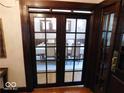 Elegant dining room, partially visible through glass doors at 909 E 38Th St, Indianapolis, IN 46205