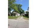 Cute house with a single car garage and a gravel driveway at 3912 Terrace Ave, Indianapolis, IN 46203
