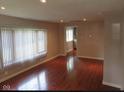 Bright and airy living room with hardwood floors at 3912 Terrace Ave, Indianapolis, IN 46203