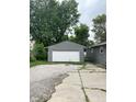 Detached single-car garage with a large driveway at 533 Lynn St, Indianapolis, IN 46222
