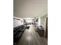 Spacious living room with hardwood floors and sectional sofa at 1062 N Berwick Ave, Indianapolis, IN 46222