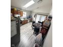 Kitchen with wood cabinets, granite countertop, and stainless steel appliances at 1062 N Berwick Ave, Indianapolis, IN 46222