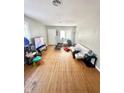 Living room with hardwood floors and a white couch at 3521 N Riley Ave, Indianapolis, IN 46218