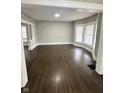 Spacious living room featuring hardwood floors and bay windows at 20 N Pershing Ave, Indianapolis, IN 46222