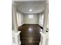 Open living room with hardwood floors and neutral walls at 20 N Pershing Ave, Indianapolis, IN 46222