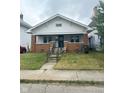 Charming craftsman home with brick details and porch at 57 N Tremont St, Indianapolis, IN 46222