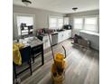 Eat-in kitchen with white cabinets and hardwood floors at 57 N Tremont St, Indianapolis, IN 46222
