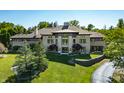 Luxury home with a modern design, large windows, and a landscaped yard at 4023 Cedar Hills N Dr, Greenwood, IN 46143