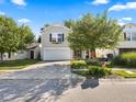 Two-story house with a white garage door and landscaped yard at 917 Balto Dr, Shelbyville, IN 46176
