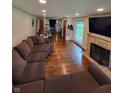 Spacious living room with hardwood floors and fireplace at 1231 E 88Th St, Indianapolis, IN 46240