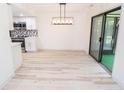 Bright dining area with hardwood floors and sliding glass doors at 2424 N Willow Way, Indianapolis, IN 46268