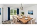Dining room with wooden table and access to deck at 22133 State Road 37 N, Noblesville, IN 46060