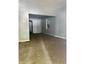 Spacious living room with gray walls and brown carpet at 642 N Oxford St, Indianapolis, IN 46201