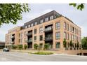 Contemporary apartment building with brick facade and balconies at 877 N East St # 104, Indianapolis, IN 46202