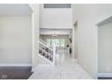 Bright entryway with marble flooring and staircase at 372 Foxboro Cir, Avon, IN 46123