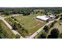 Aerial view of farm with paddocks and outbuildings at 9407 N Whitney Way, Monrovia, IN 46157
