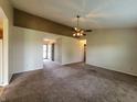 Spacious living room with neutral carpeting and a ceiling fan at 1096 Bumblebee Way, Greenfield, IN 46140