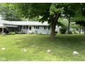 House with large green lawn and tree at 3500 W 30Th St, Muncie, IN 47302