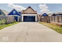 Modern garage with a large driveway and a stylish A-frame design at 1544 Hoyt Ave, Indianapolis, IN 46203