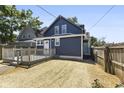 Blue house with a deck and a partially fenced yard at 249 N Beville Ave, Indianapolis, IN 46201