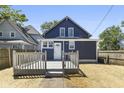 Blue house with spacious deck and fenced yard at 249 N Beville Ave, Indianapolis, IN 46201