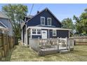 Blue house with large deck and backyard at 249 N Beville Ave, Indianapolis, IN 46201