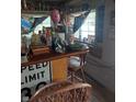 Small bar area with eclectic decor and wooden bar top at 2220 S Burke St, Indianapolis, IN 46231