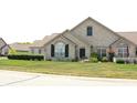 Stone front home with landscaping and green lawn at 2148 Heather Glen Way, Franklin, IN 46131