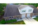 Two-story home with double garage and landscaped yard at 7433 Prairie Lake Dr, Indianapolis, IN 46256