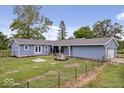 Ranch house with light blue siding and landscaping at 9996 N County Road 200 W, Muncie, IN 47302