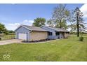 Ranch house with attached garage and stone accents at 9996 N County Road 200 W, Muncie, IN 47302