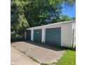Three-car garage with green doors at 3526 N Capitol Ave, Indianapolis, IN 46208