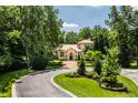 Luxury home situated on a spacious lot with a circular driveway at 841 Alverna Dr, Indianapolis, IN 46260