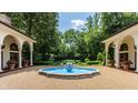 Tranquil courtyard with a central fountain, creating a serene outdoor space at 841 Alverna Dr, Indianapolis, IN 46260
