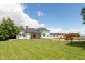 Spacious backyard with playground, expansive lawn, and partial home view at 3917 N 525 W, Fairland, IN 46126