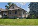 House exterior with front porch and lawn at 41 S Sherman Dr, Indianapolis, IN 46201