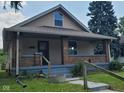 House exterior with front porch and yard at 41 S Sherman Dr, Indianapolis, IN 46201