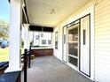Covered front porch with brick columns and new door at 3442 N Capitol Ave, Indianapolis, IN 46208