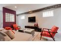 Bright living room featuring comfortable seating, a large TV, and stylish decor at 610 N Park Ave, Indianapolis, IN 46204