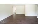 Bright living room with hardwood floors and open concept view to kitchen at 3720 Breen Dr, Indianapolis, IN 46235