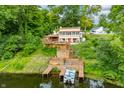 Aerial view of a waterfront home with dock and boat at 409 W Lakeview Dr, Nineveh, IN 46164