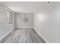 Simple bedroom with grey walls and wood-look flooring at 929 Olin Ave, Indianapolis, IN 46222