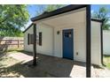 Modern house with a blue door and covered porch at 929 Olin Ave, Indianapolis, IN 46222