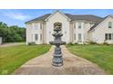 Elegant two-story home with a fountain and landscaped lawn at 8292 S State Road 39 S Rd, Clayton, IN 46118