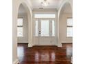 Grand entryway with hardwood floors and arched doorways at 8235 Ridge Valley Ct, Indianapolis, IN 46278