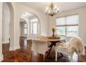 Bright dining room with hardwood floors and a round table at 8235 Ridge Valley Ct, Indianapolis, IN 46278