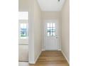 Bright entryway with hardwood floors and white door at 19155 River Jordan Dr, Westfield, IN 46074