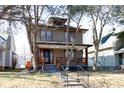 Two-story house with a porch and landscaping at 526 N Emerson Ave, Indianapolis, IN 46219