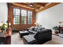 Spacious living area with exposed brick and large windows at 735 Lexington Ave # 7, Indianapolis, IN 46203