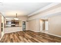 Open concept living room with laminate floors and kitchen view at 2719 E 28Th St, Indianapolis, IN 46218